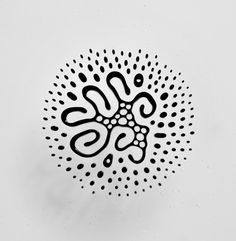 a black and white photo of an abstract design on a paper background with the letter s in it's center