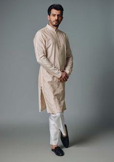 Editor's Note The light cream kurta with yoke and pants is a stylish and versatile ensemble. The kurta features a light cream color with a yoke design, adding a touch of elegance to the overall look. It is paired with matching pants for a coordinated outfit. Fabric: Cotton silk Color: Beige Components: Kurta and pants Occasion: Festive Note: Product colour may slightly vary due to photographic lighting sources Care: Dry clean only About the Designer Chatenya Mittal is a menswear label that draws Yoke Design, Blouse Yoke, Kurta Pyjama, Vacuum Storage, Indian Wedding Wear, Silk Kurta, Stitch Lines, Pajama Pant, Ivory Silk