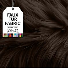 a tag that says faux fur fabric by the yard