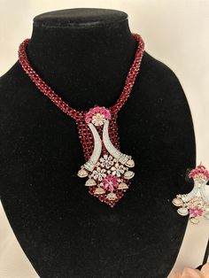 Beautiful vintage and hydro beads necklace with silver diamond work and a modern luxurious look for any jewelry lover! This necklace comes with matching earrings that are perfect to wear alone for a lighter look. High Quality Silver and Ruby finish with beaded work, this set is sure to be a perfect addition to any wardrobe! This lightweight and elegant necklace is perfect for any bridesmaid, bride, sangeet or any occasion or event as a gift for any occasion as any one who loves jewelry will love Elegant Red Jewelry Sets For Festive Occasions, Ruby Necklaces With Sparkling Stones For Party, Party Ruby Necklaces With Sparkling Stones, Party Ruby Necklace With Sparkling Stones, Traditional Festive Necklace With Sparkling Stones, Elegant Red Beaded Jewelry Set, Elegant Red Bridal Necklace With Sparkling Stones, Traditional Necklace With Sparkling Stones, Elegant Red Rhinestone Necklaces