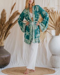 Our Aphrodite Short Kimono, made from soft viscose double gauze fabric, offers a luxurious feel and an ethereal appearance. Designed to enhance your presence in any setting, its flowing silhouette and lightweight, breathable fabric ensure a graceful and comfortable fit. Ideal for lounging by the pool or attending special events, this piece is perfect for making a statement. Its versatile design provides multiple styling options, making it an indispensable addition to your wardrobe. Celebrate your divine beauty and radiate grace with our reversible Short Kimono. Chic Long Sleeve Kimono For Loungewear, Elegant Long Sleeve Sleepwear For Vacation, Chic Flowy Kimono For Loungewear, Oversized Chic Kimono For Loungewear, Viscose Sleepwear For Summer, Elegant Flowy Sleepwear For Loungewear, Chic Relaxed Fit Sleepwear For Vacation, Chic Relax Fit Sleepwear For Vacation, Flowy Long Sleeve Kimono For Loungewear