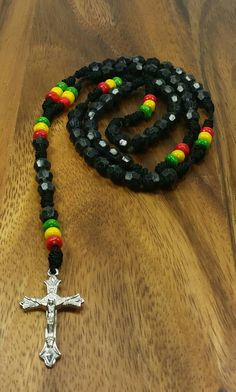 "Rasta Rosary Necklace Color: Black 20\" Inches Long Unisex Rosary FAST SHIPPING! Visit my Etsy Shop to see more Rasta Style Jewelry and Beanies! At Freedom Life Style Jewelry you will find a variety of Rasta Necklaces, Rasta Earrings and Rasta Bracelets. Click here to see more designs: https://www.etsy.com/shop/FreedomLifeStyle" Adjustable Black Rosary With Cross, Black Beaded Cross-shaped Rosary, Black Beaded Cross Rosary, Adjustable Black Cross Rosary, Black Wooden Beads For Jewelry Making, Handmade Black Rosary For Gift, Handmade Black Rosary Gift, Adjustable Black Spiritual Rosary, Black Wooden Beads Rosary Spiritual Style