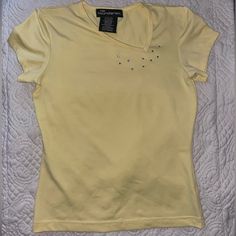 No Boundaries Juniors Size Small 3/5 Y2k Style Baby Tee/Cropped T-Shirt Asymmetrical Neckline Rhinestone Embellishments Like New This Yellow Shirt Is Super Cute And Screams Y2k. The Asymmetrical Neckline Is So Unique And Hard To Find. Dry Stylish Design With The Rhinestone Embellishments. Labeled A Juniors Small With A Lot Of Stretch. Would Look Great With A Pink Mini Skirt Or Jeans. It’s In Excellent Condition And Looks Brand New. I Have Lots Of Y2k And Fun Clothes On My Page, Bundle To Save! Yellow Fitted Y2k Top, Fitted Yellow Y2k Tops, Yellow Fitted Y2k T-shirt, Fun Clothes, Pink Mini Skirt, Yellow Shirt, Rhinestone Embellishments, Asymmetrical Neckline, Yellow Shirts