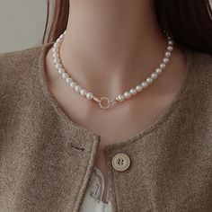 Elevate any outfit with our Classic Round Pearl Necklace for Women! This stunning necklace is the perfect gift for the special woman in your life. The timeless design boasts a round pearl that will add a touch of elegance and sophistication to any look. Show her how much she means to you with this beautiful necklace. Color: White, GrayMaterial: 18K White Gold Plated Copper Stone: Cubic ZirconiaPearl: High Quality Artificial Round PearlPearl Size: 8mm~9mmLength: 45cm ~ 17InchThis necklace is made of 8mm round pearls, which are strung on a silk thread. The pearls are a classic white color and have a high luster. The necklace is 18 inches long and has a sterling silver clasp. Classic Pearl White Necklace With Clavicle Chain, Feminine Round Pearl Chain Jewelry, Feminine Pearl Necklace, Pearl White Pearl Necklace With Round Pendant, Elegant Round Pearl Necklace For Gift, Classic Necklaces With Clavicle Chain And Round Beads, Pearl Clavicle Chain Necklace, Classic Clavicle Chain Necklace With Round Beads, Classic Clavicle Chain Necklaces With Round Beads