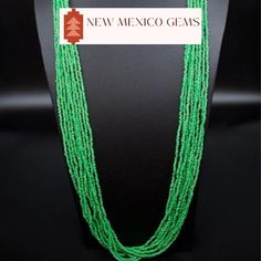 This is a multi strand green glass seed bead necklace. Southwestern glass green seed bead necklace. Dress it up or down. Great for the office.  *10 strands of glass seed beads *Adjustable length on this beauty up to 33". Has a lobster clasp. *Gift boxes available. All jewelry also comes in a nice box.  *Check out the rest of our collection: https://www.etsy.com/shop/NewMexicoGems Thank you for your business. We appreciate you. Green Southwestern Jewelry With Spacer Beads, Green Multi-strand Jewelry With Tiny Beads, Green Multi-strand Beaded Jewelry, Southwestern Green Jewelry With Spacer Beads, Southwestern Style Green Jewelry With Spacer Beads, Green Beaded Multi-strand Turquoise Necklace, Traditional Green Multi-strand Beads, Traditional Green Multi-strand Beaded Necklaces, Green Tiny Multi-strand Beads