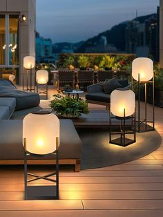 modern outdoor furniture with lights on the floor and in front of a cityscape