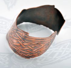 Celtic owl cuff - Viking owl cuff - celtic bracelet - copper bangle - Norse cuff - celtic knotwork - barn owl, pagan band - shamanic jewellery This beautiful Celtic owl cuff is made from solid copper and is completely handmade by me in my studio workshop. The original design is hand drawn by myself, first designing the outer shape of the owl and then carefully planning the celtic knotwork in the wings to fit sympathetically to the shape. Once I have completed the hand drawn design, I then digiti Medieval Handmade Cuff Bracelet As A Gift, Handmade Medieval Cuff Bracelet As Gift, Viking Style Handmade Bracelets As Gift, Handmade Medieval Cuff Bracelet For Gifting, Handmade Viking Style Bracelets For Gifts, Handmade Viking Style Bracelet, Spiritual Bronze Copper Cuff Bracelet, Leather Wristbands Celtic, Celtic Owl