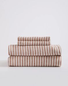 three striped towels stacked on top of each other