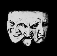 two masks with faces painted on them in black and white