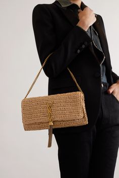 SAINT LAURENT's 'Kate' shoulder bag is made from woven raffia in a classic baguette style. It's embellished with the iconic 'YSL' logo and a fringed tassel that matches the gold-tone chain strap. The smooth leather interior is complete with a zip pocket for easy access to small essentials. Luxury Straw Shoulder Bag In Rectangular Shape, Luxury Rectangular Straw Shoulder Bag, Designer Handwoven Rectangular Shoulder Bag, Luxury Rectangular Straw Bags, Designer Rectangular Straw Bag With Gold-tone Hardware, Luxury Rectangular Straw Bag, Luxury Evening Straw Shoulder Bag, Luxury Straw Evening Bag, Luxury Straw Bags With Gold-tone Hardware