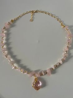 ♡ The materials that are used for our hand made necklaces are , rose quartz gemstone , crystals, gold plated apparatus and at the end of necklaces are made by zircon stones. ♡ To extend its lifespan, do not contact it with chemical products like perfumes ,moisturizers etc. Do not pull or tug on the necklace. Rose Quartz Chips Necklace, Rose Quartz Beaded Necklace, Rose Quartz Jewelry Necklaces, Gold Rose Quartz Jewelry For Jewelry Making, Gold Necklaces With Gemstone Accents For Healing, Gold Rose Quartz Gemstone Jewelry, Gold Crystal Necklace With Stones For Jewelry Making, Gold Rose Quartz Pendant Jewelry, Rose Quartz Gemstone Gold Jewelry