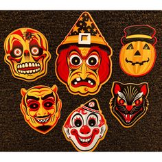 six halloween masks with different designs on them, all decorated in orange and red colors