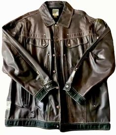 UP FOR SALE IS AN AWESOME: (PRE-OWNED) AKADEMIKS 100% GENUINE LEATHER BROWN/w DENIM TRIM Jacket Men's Size XXL • EXTREMELY RARE.... Gorgeous, Genuine Premium Leather /w Denim Jean Trim and Lining by AKADEMIKS™ • Chocolate-Brown leather with denim accents cover the entire exterior, and Denim trim accents the waist and cuffs • Buttery-Soft, Supple Lambskin Premium Leather • band at back of jacket~spells out Akademiks • Thick and Warm Medium weight Leather + Denim great as a Stand-alone, or layerin Distressed Brown Outerwear For Fall Streetwear, Vintage Brown Fall Outerwear For Streetwear, Brown Button-up Leather Jacket With Button Cuffs, Vintage Brown Fall Streetwear Outerwear, Brown Fitted Masculine Leather Jacket, Formal Brown Single-breasted Leather Jacket, Brown Leather Button-up Outerwear, Brown Double-breasted Leather Outerwear, Trim Jacket