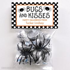 there is a bag of halloween candies in the shape of a spider and polka dots