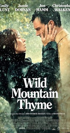 the movie poster for wild mountain thyne with two people embracing each other in the rain