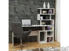 a computer desk sitting in front of a book shelf