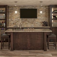 a bar with two stools and a television mounted to the wall in a basement