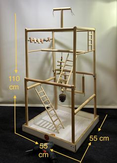 a wooden structure with ladders on it and measurements for the top part of the structure