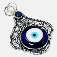 Brand New Handmade Blue Evil Eye And Blue Topaz Silver Pendant. 925 Stamped The Evil Eye, Often Known As A ‘Nazar’ Is An Amulet Believed To Protect Humans Against The ‘Evil Eye.’ It Brings Good Luck - By Carrying An Evil Eye Charm Or Casting Out An Evil Eye Symbol Its Said To Magically Bestow Good Luck, Health And Happiness To Its Beholder. It Possesses Good Vibes - With Blue As Its Main Colour, It’s Said To Radiate Positive Energy And Possess Good Karma. The Light Blue Within It Also Represents Blue Sterling Silver Evil Eye Jewelry, Traditional Blue Evil Eye Jewelry, Handmade Evil Eye, Beaded Collar Necklace, Party Necklace, Leather Corded Necklace, Sterling Necklaces, Beaded Pendant Necklace, Sapphire Pendant