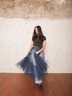 Our Yvonne Tulle Skirt is the ultimate statement piece for layering! With its high-rise elastic waistband and sheer, layered tulle, this midi skirt adds a dreamy touch to any outfit. Pair it with a fitted top and heels for a standout evening look, or wear it over jeans for an edgy daytime vibe. Details High Rise Pull-On Style Elastic Waistband Sheer Layered Tulle Midi Length Size recs: 0-4 Small, 4-6 Medium, 8-10 Large Provides lots of stretch Fall Pleated Tulle Skirt, Fall Tulle Pleated Skirt, Chic Tulle Skirt For Fall, Fall Tiered Tulle Skirt, Summer Tulle Maxi Flared Skirt, Long Tulle Skirt For Spring, Summer Flared Tulle Maxi Skirt, Fall Tulle Long Skirt, Spring Tulle Skirt With Stretch