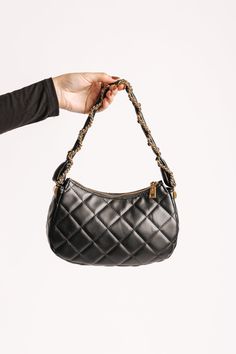 The Ellie Black Faux Leather Quilted Shoulder Bag is a chic, clutch-style accessory made from vegan leather with a luxurious quilted design! It features a secure zip closure, keeping your essentials safe while maintaining a sleek appearance. The bag is adorned with a twisted chain and faux leather strap, offering a sophisticated touch alongside the gold hardware accents. Inside, the fabric-lined interior includes one zip pocket and one slip pocket, providing ample space for organization. This versatile bag is perfect for adding a touch of elegance to any outfit! Chic Quilted Clutch For Everyday Use, Chic Quilted Evening Clutch, Chic Quilted Clutch Bag, Trendy Leather Clutch With Zipper Closure, Revival Clothing, Fall Style Guide, Twisted Chain, Gameday Dress, Quilted Shoulder Bag