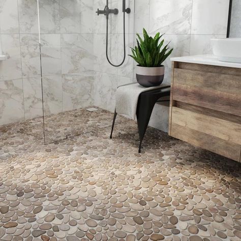 LEVEL PEBBLE meshes the aesthetic of our Perfect Pebble with the flawless flat surface of our Random tiles. It is the ideal solution for customers who require a flatter surface yet desire the appearance of natural pebble. Utilizing our original interlocking pattern this addition to our Pebble Series opens up a new realm of surfacing possibilities. Pebble Bathroom Floor, River Rock Bathroom, Stone Shower Floor, River Rock Shower, Stone Floor Bathroom, Pebble Tile Shower, Pebble Shower Floor, Rock Shower, Decorating Bathrooms