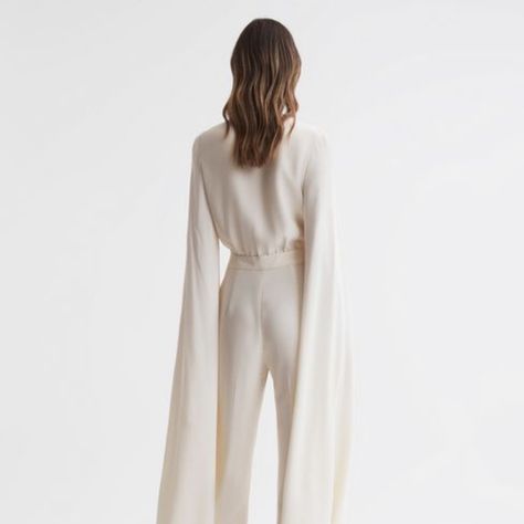 Reiss Olivia Cape Sleeve V-Neck Jumpsuit (Ivory) Brand New; Has Never Been Worn. I Paid $600 For It, But Price Has Come Down On Website. Size Us 10. Tags Still Attached. Chiffon Jumpsuit, Long Cape, Silk Jumpsuit, Bridal Jumpsuit, Cape Style, Power Dressing, Jumpsuit Online, Cape Sleeves, Plunge Neckline