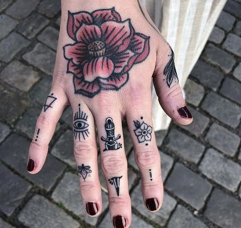 In a society captivated by grandiose ink masterpieces, small hand tattoos serve as a subtle yet impactful way to express your individuality. Finger Tattoo Trad, Sick Finger Tattoos, Traditional Style Finger Tattoos, Neo Traditional Finger Tattoos, Women Knuckle Tattoo Ideas, Finger Tattoo Traditional, Traditional Finger Tattoos Women, Spiderweb Finger Tattoo, Finger Tattoos Traditional