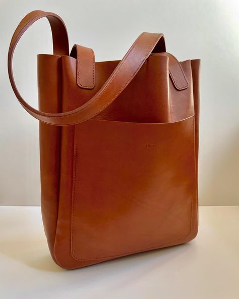 Double thick, hand stitched straps - takes ages but so worth it 👌🏼 #leather #leathercraft #leatherwork #tote #totebag #leathertote #leathergoods #leatherstudio #accessories #bag #leatherbag #handmade #madebyhand #handstitched #design #minimal #handmadebag Leather Handles Laptop Bag Tote For On-the-go, Dark Tan Tote Bag With Leather Lining, Brown Recycled Leather Tote Bag, Eco-friendly Satchel Tote With Leather Handles, Dark Tan Leather-lined Tote Bag, Accessories Bag, Design Minimal, Handmade Bags, Worth It