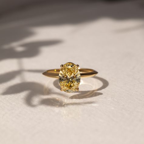 The Chelsea with custom knife edge band💍 💎Details -Fancy yellow -Oval cut -VS1 -2.5ct -18k yellow gold #engagementring #ovalengagementring #proposal Yellow Stone Engagement Rings, Yellow Oval Engagement Ring, Wedding Rings Yellow Diamond, Oval Yellow Diamond Ring, Yellow Ring Engagement, Yellow Oval Diamond Ring, Yellow Diamond Ring Engagement, Engagement Rings Yellow Stone, Unique Classic Engagement Rings