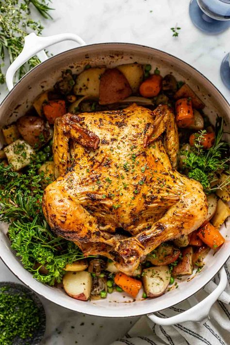 Pot Roast Chicken is an all-in-one pot meal that is both cozy and festive. Serve it for a holiday meal, Sunday supper, or just when you want a bit of home-cooked goodness to warm you from the inside out. The combination is deliciously simple: tender potatoes, mushrooms and carrots, bright green peas, fresh herbs and juicy chicken all tied together with a savory buttery sauce. Enjoy all of the comforts of pot roast without the red meat! Pot Roast Chicken Recipes, Dutch Oven Roasted Chicken, Chicken Pot Roast, Slow Roast Chicken, Pot Roast Chicken, Dutch Oven Roast Chicken, Oven Roasted Whole Chicken, Healthy Cornbread, Potatoes Mushrooms