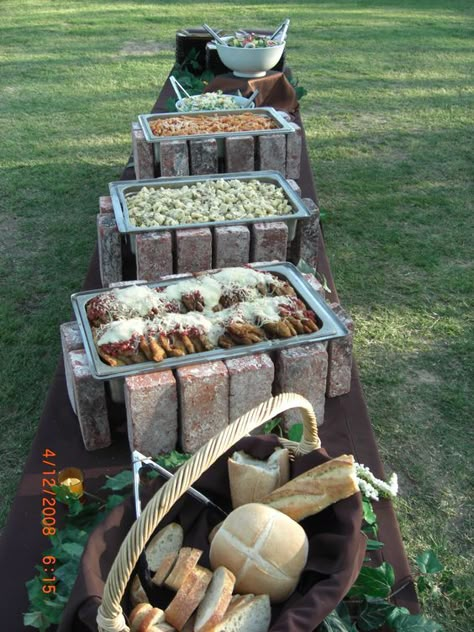 If you're looking for a rustic wedding idea for your buffet, think about using red bricks to prop up your chafer dishes. If you want to see more, check out our website at http://cateringaffairsinc.com: Backyard Party Food Table, Katering Pernikahan, Backyard Party Food, Wedding Food Table, Bbq Buffet, Food Display Table, Wedding Buffet Food, Catering Buffet, Catering Display