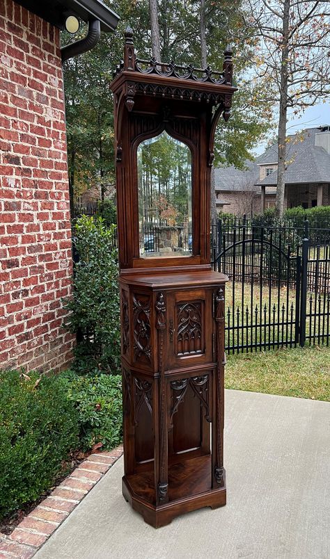 Antique French Gothic Revival CARVED Walnut Mirrored Credence Cupboard or Cabinet~~VERSATILE SIZE~~c. 1880s     CHARMING antique cabinet in popular French Gothic Revival style~~upper canopy with pierced gallery and drop finials, lower single cabinet door with shelved interior, carved tracery accents, arches, and figural saint resting on canted corner posts~ key is included~~can be moved in 2 pieces      VERSATILE size~~only 14.5" deep~~fits in small spaces~~perfect for an entry or hallway, praye Vintage Gothic Furniture, Victorian Gothic Furniture, Gothic Revival Interior, Antique Furniture In Modern Home, Gothic Shelf, Single Cabinet, French Gothic, Gothic Interior, Cupboard Cabinet