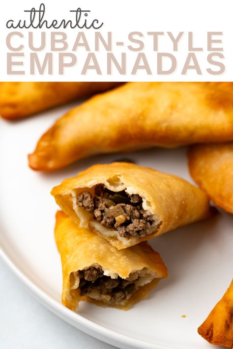 A beef filled cuban empanadas made with homemade empanada dough with more empanadas on the same plate with the words "authentic cuban-style empanadas" in the foreground Cuban Empanadas Recipe, Cuban Empanadas, Cuban Rice And Beans, Empanada Dough, Pumpkin Flan, Cinnamon Simple Syrup, Guava Paste, Empanadas Dough, Cuban Dishes