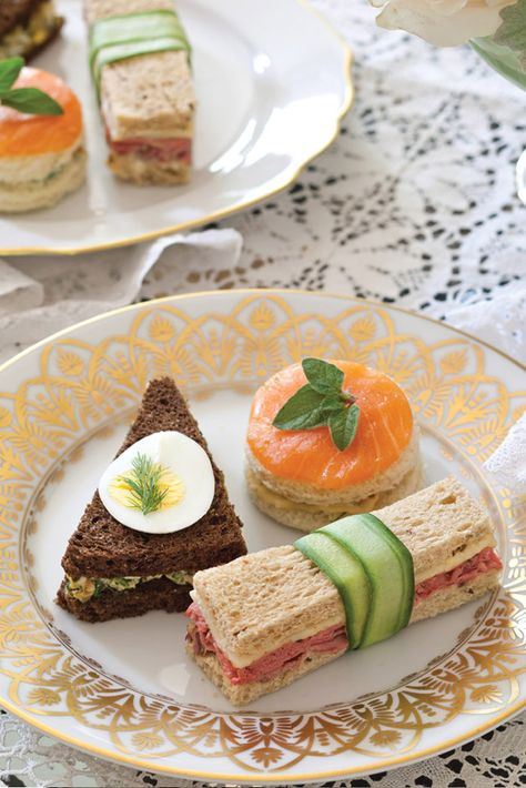 A plate of distinctively shaped sandwiches creates a hearty mix of options that will satisfy late-afternoon appetites. Pretty Tea Sandwiches, Winter Tea Sandwiches, Tea Party Food Sandwiches, Winter High Tea, Smoked Salmon Tea Sandwiches, Salmon Tea Sandwiches, Triangle Sandwiches, Beef Tea, Recept Sandwiches