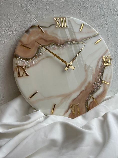 This elegant geode epoxy wall clock will be a great decoration for your bedroom, living room, office and kitchen. Will please your friends and relatives on a wedding, birthday, anniversary, housewarming and any other holiday. Geode made of premium quality epoxy resin, decorated with stones.  It is possible to create a picture according to your preferences. You can also order a picture in a different size and color. For more details, write to me  :) I will be happy to help you Epoxy Resin Pictures Ideas, Resin Art Wall Clock Design, Resin Wall Clock Ideas, Wall Resin Art, Geode Clock Resin, Resin Room Decor, Resin Wall Clocks, Epoxy Resin Clocks, Epoxy Clock Design