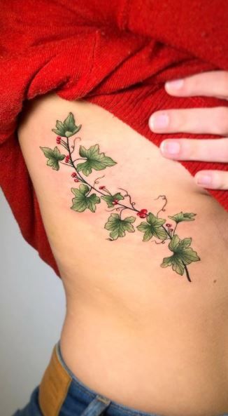 Ivy Vine Tattoo For Women, Ivy With Flowers Tattoo, Ivy Rib Tattoo, Holly And Ivy Tattoo, Holly Vine Tattoo, Vine Side Tattoo, Cherry Vine Tattoo, Grapevine Tattoos For Women, Flowering Vine Tattoo