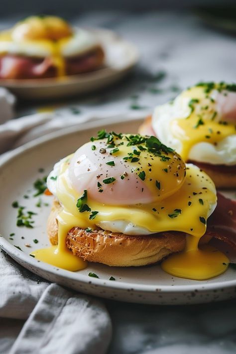 Looking for the perfect brunch recipe? Try our delicious eggs benedict recipe today! Treat yourself to fluffy poached eggs, crispy bacon, and creamy hollandaise sauce. This classic dish is sure to impress your friends and family. Whether it's a special occasion or a lazy weekend morning, eggs benedict is always a good idea. Follow our step-by-step instructions to create the ultimate breakfast indulgence that will leave everyone coming back for more. Egg Benedict Sandwich, Special Egg Recipes, Classic Eggs Benedict, Hollandaise Breakfast Ideas, Poached Eggs Recipe Breakfast, Fancy Egg Dishes, Poached Egg Dishes, Best Eggs Benedict Recipe, Luxury Breakfast Aesthetic