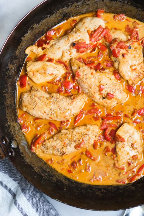 Looking for an easy chicken recipe? This roasted red pepper chicken recipe can be made in your skillet in less than 30 minutes! It's low carb and can is the perfect skillet supper to throw together for your weeknight dinner. So if you're in the market for more chicken recipes, this is it! #chickenrecipe #chickenrecipeseasy #chicken #chickenrecipeshealthy #skilletsupper #skilletideas #skilletrecipes #chickenskilletrecipe Creamy Chicken With Roasted Red Peppers, Red Pepper And Chicken Recipes, Roasted Red Pepper Recipes Chicken, Chicken Recipe With Peppers, Roasted Red Pepper Chicken Chili, Chicken And Roasted Peppers Recipes, Chicken And Roasted Red Peppers Dinners, Roasted Red Pepper And Chicken Recipes, Roasted Red Pepper Ideas