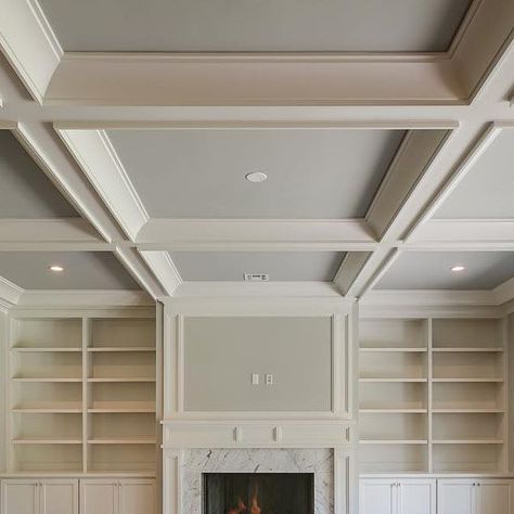 Ariella Horowitz on Instagram: "Built ins and a coffered ceiling for the family room #familyroom #trimwork #builtins #ceilingdesign #cofferedceiling #classic #timeless #transitionaldesign #hamptonsstyle #fireplace #marblesurround #naturallight #hardwoodfloors #designer #designideas #interiordesign #homebuilder #newconstruction #bergencounty #njrealestate #hgtv #luxuryliving #luxuryhomes #the_real_houses_of_ig  #inspire_me_home_decor #oakdriveproject" Coffered Ceiling Ideas Living Room Wood, Great Room With Coffered Ceiling, Coffered Ceiling Fireplace, Living Room With Coffered Ceiling, Coffered Ceiling With Fireplace, Modern Coffered Ceiling Design, Coffered Ceiling Open Floor Plan, Beams In Living Room Ceiling, Simple Coffered Ceiling