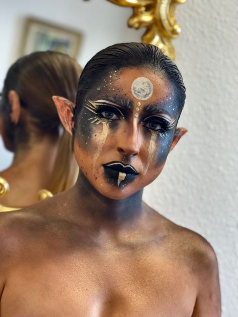 Gold Alien Makeup, Black Woman Gold Makeup, Black And Gold Eye Makeup Tutorial, Moon Elf Makeup, Hades Inspired Makeup, Nyx Goddess Makeup, Gold Fairy Makeup, Lunar Makeup, Steampunk Makeup Halloween