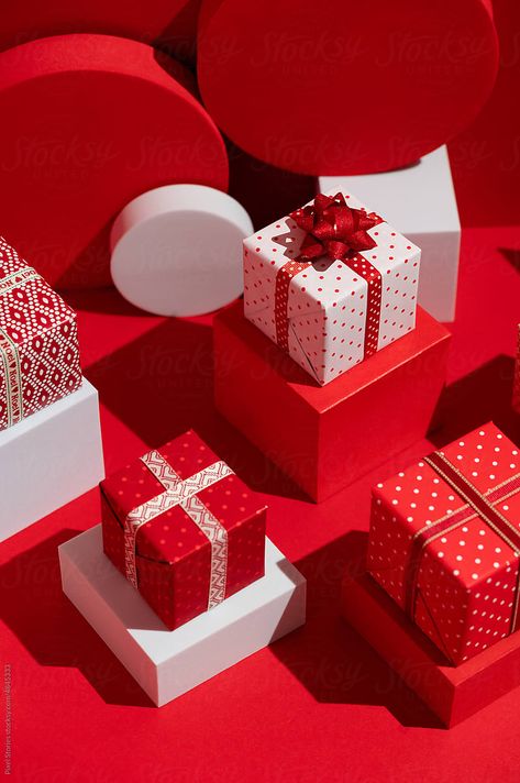 "Christmas Presents. Red And White Themed Gift Holiday Background." by Stocksy Contributor "Pixel Stories" - Stocksy Pile Of Christmas Presents, Christmas Theme Product Photography, Product Christmas Photography, Christmas Present Stack, Xmas Photobooth, Holiday Product Photography, Christmas Product Photography, Christmas Gift Photography, Laydown Photography