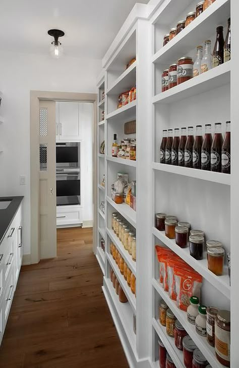 Storage is a necessity in a pantry and this well-designed pantry closet features just that. Pantry With Shallow Shelves, Narrow Shelf Pantry, Narrow Pantry Storage, Walk In Pantry Wall Ideas, Narrow Wall Pantry, Shallow Pantry Shelving Ideas, Shallow Wall Pantry Ideas, Narrow Long Pantry Ideas, Long And Narrow Pantry Ideas