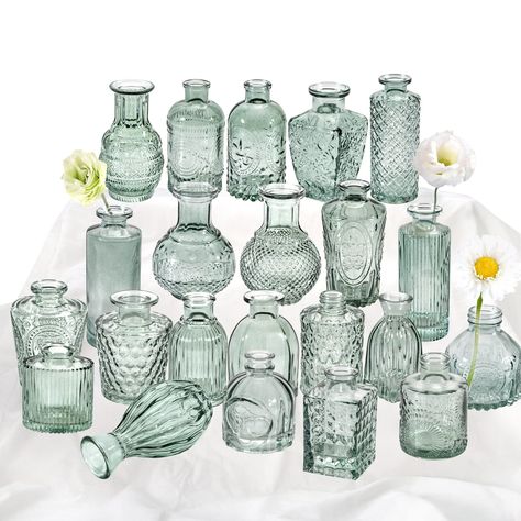 PRICES MAY VARY. 🌷【Different Vintage Look, Green Rustic Design】🌷 Contains 22 bud vases of different shapes, this set of glass vases for centerpieces is the design of relief on the glass surface, which is exquisite, beautiful and unique. The different designs & heights & shapes make the collection interesting to look at even without flowers. 🌷【High Quality Small Glass Vase】🌷 Our 22pcs small glass vase set is made of high-quality glass. Our glass is much thicker then others, small bud vase is Fish Bowl And Square Vase Centerpiece Wedding, Glass Vases Centerpieces With Pictures, Short Eucalyptus Centerpiece, Affordable Small Flower Centerpiece, Square Vase Centerpieces Michaels Stores, Small Candle Vases, Medium Glass Vase Centerpiece, Greenery Graland With Bud Vase, Lantern With Fairy Lights Succulents Centerpieces