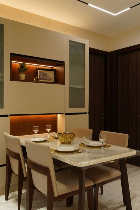 The customized dining tableis designed to be a part of the crockery unit that has under-cabinet strip lighting and plenty of storage space. Corner Dining Table, Wall Dining Table, Crockery Cabinet Design, Diy Projects Wood, Crockery Cabinet, Wood Working Ideas, Crockery Unit Design, Crockery Design, Crockery Unit