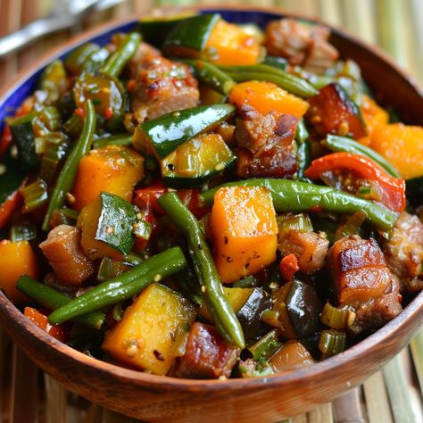 🌿 Enjoy a healthy and flavorful Filipino vegetable dish with Pinakbet! 🌿 #Pinakbet #HealthyEating Pinakbet Ingredients: Pork belly (1/2 lb, sliced) Bitter melon (1, sliced) Eggplant (1, cubed) Squash (1 cup, cubed) String beans (1 cup, cut into 2-inch pieces) Okra (1 cup, cut into 2-inch pieces) Tomatoes (2, quartered) Onion (1, chopped) Garlic (4 cloves, minced) Fish sauce (2 tbsp) Water (1 cup) Shrimp paste (2 tbsp) Instructions: Sauté garlic, onion, and tomatoes until soft. Add pork be... Pinakbet Recipe Filipino Food, Filipino Ulam, Pinoy Ulam, Filipino Vegetable Dishes, Pinakbet Recipe, Sliced Eggplant, String Beans, Instagram Recipes, Twisted Recipes