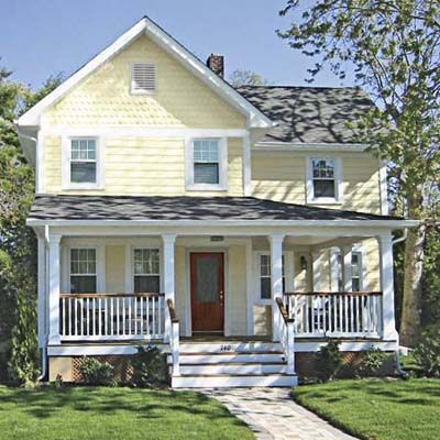 A field of spotless siding helps a home's details stand out. So the owner chose a material and style that would more closely match the look of the original siding, offer easy maintenance, and set the stage for a friendlier entryway and new roofing. Yellow House, Exterior Stone, Farmhouse Exterior, Red Door, Exterior House, White Trim, Curb Appeal, Front Porch, White House