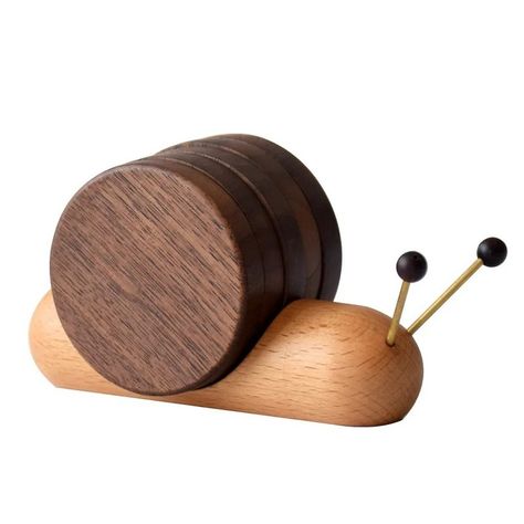 he perfect touch for your home! 🌀✨ Add a touch of charm to your coffee table with our Handcrafted Wooden Snail Coaster Set! This set of 5 comes with a handy holder and is perfect for all your beverages – tea, coffee, milk, you name it! These rustic drink coasters make an ideal housewarming gift too. 🏡❤️ #HomeDecor #CoasterSet #Handcrafted #RusticCharm #HousewarmingGift #drinkcoasters Wood Mug, Wooden Cup, Tea Coaster, Wood Turning Projects, Cup Mat, Small Wood Projects, Wooden Animals, Wooden Coasters, Wood Toys