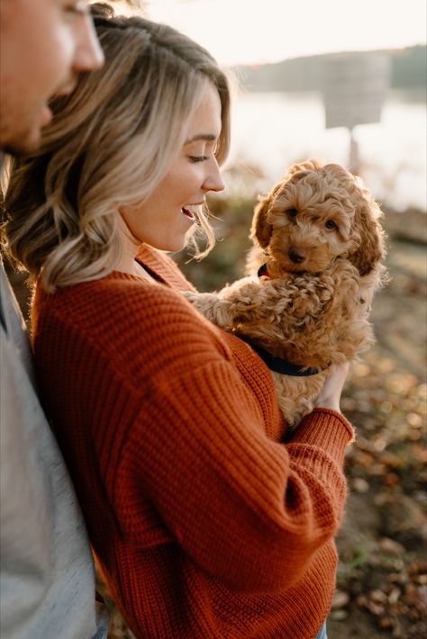 Fall session at Lake Brandt with new golden doodle puppy | by Kayli LaFon Photography, North Carolina Wedding & Elopement Photographer | Couple photos with dog New Dog Photoshoot, Puppy Photography Photo Shoots, Puppy Couple Photoshoot, Couple Pictures With Puppy, Fall Couples Photoshoot With Dog, Cute Dog Poses, Couple With Dogs Photoshoot, Couple Poses With Dog, New Puppy Photoshoot