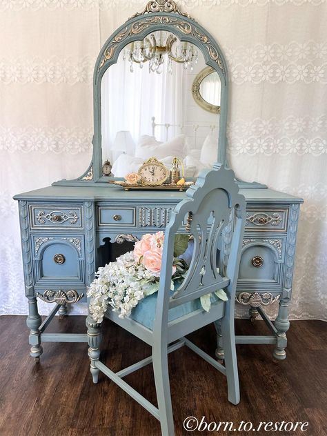 This gorgeous antique vanity is hand painted in a lovely dusty blue, sealed and highlighted with a soft gold.  It has a glamorous finish with a slight vintage look.  The five dovetail drawers are very well built, the hardware are original  The beautiful to the piece . The original mirror is aged with the characteristic of an antique mirror that is 92 years old with some small blemished just enough to give the mirror true charm while no detracting from your everyday use and add character.   The b Antique Vanity Makeover, Lace Painted Furniture, Small Vanity Ideas, Fancy Vanity, Blue Vintage Aesthetic, Ethereal Room, Pretty Mirrors, 1950 House, Unique Vanity